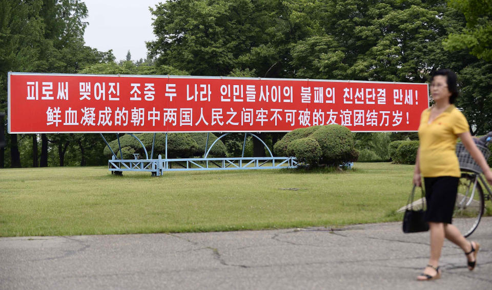 The signboard, which reads “Long Live with Unbreakable Friendship and Unity Formed by Blood” in Chinese and Korean language respectively, is displayed in Pyongyang, North Korea, Thursday, June 20, 2019. The leaders of China and North Korea were talking in the North Korean capital Thursday, with stalled nuclear negotiations with Washington expected to be on the agenda.(Kyodo News via AP)