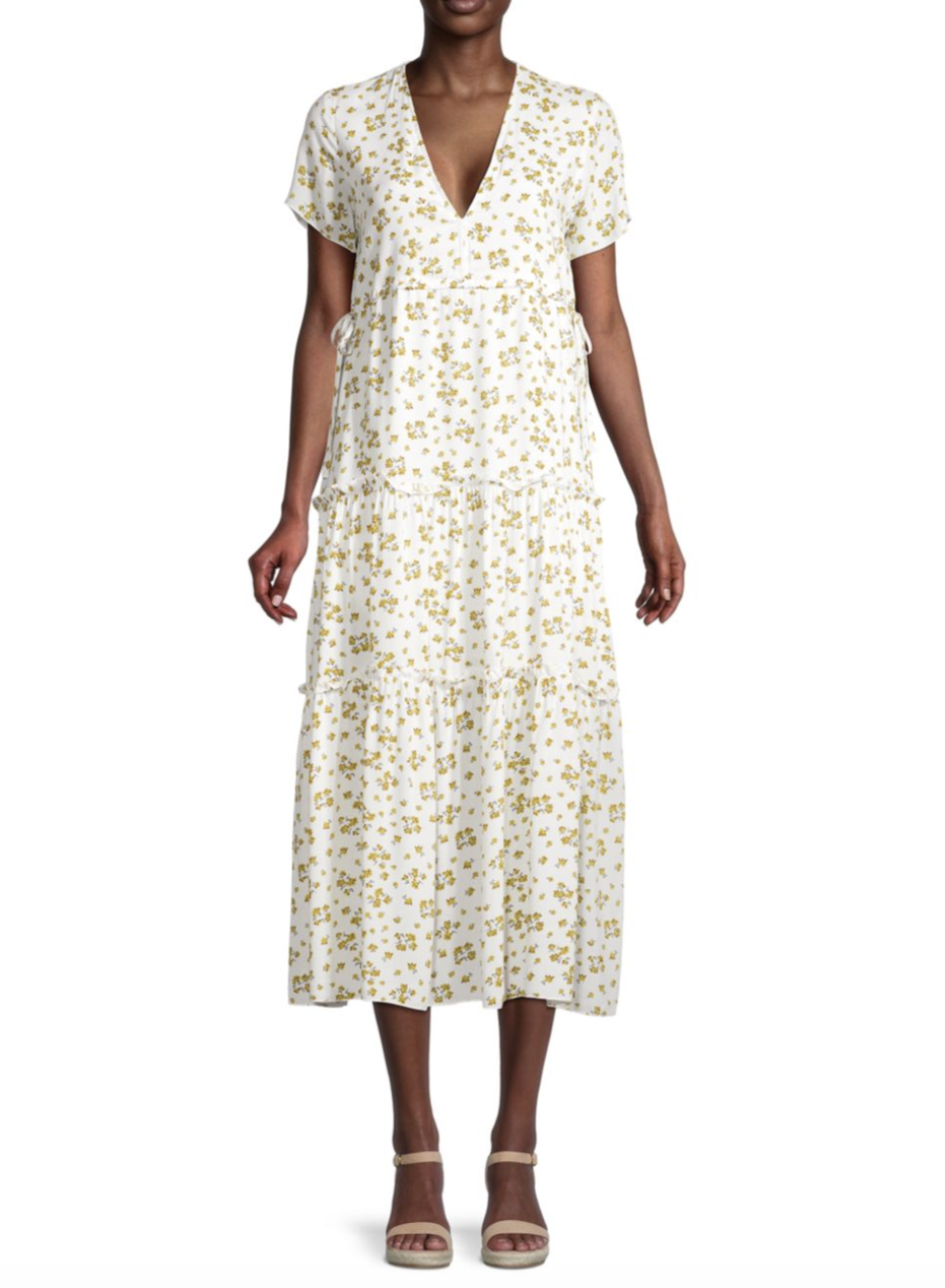 model wearing white and yellow floral To My Lovers Floral Tiered Midi Dress (photo via Saks Off Fifth)