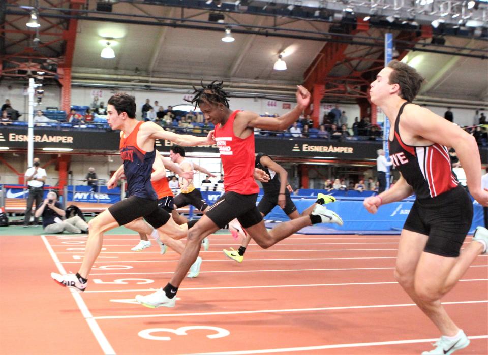 Horace Greeley's Niko Wright edges Briarcliff's Will McLay and North Rockland's Javon Lawrence at the finish of the boys 55 dash at the Section 1 State Indoor Track and Field Qualifer at The Armory Feb. 19, 2023. The three are expcted to be among the area's top 100-meter sprinters this spring.