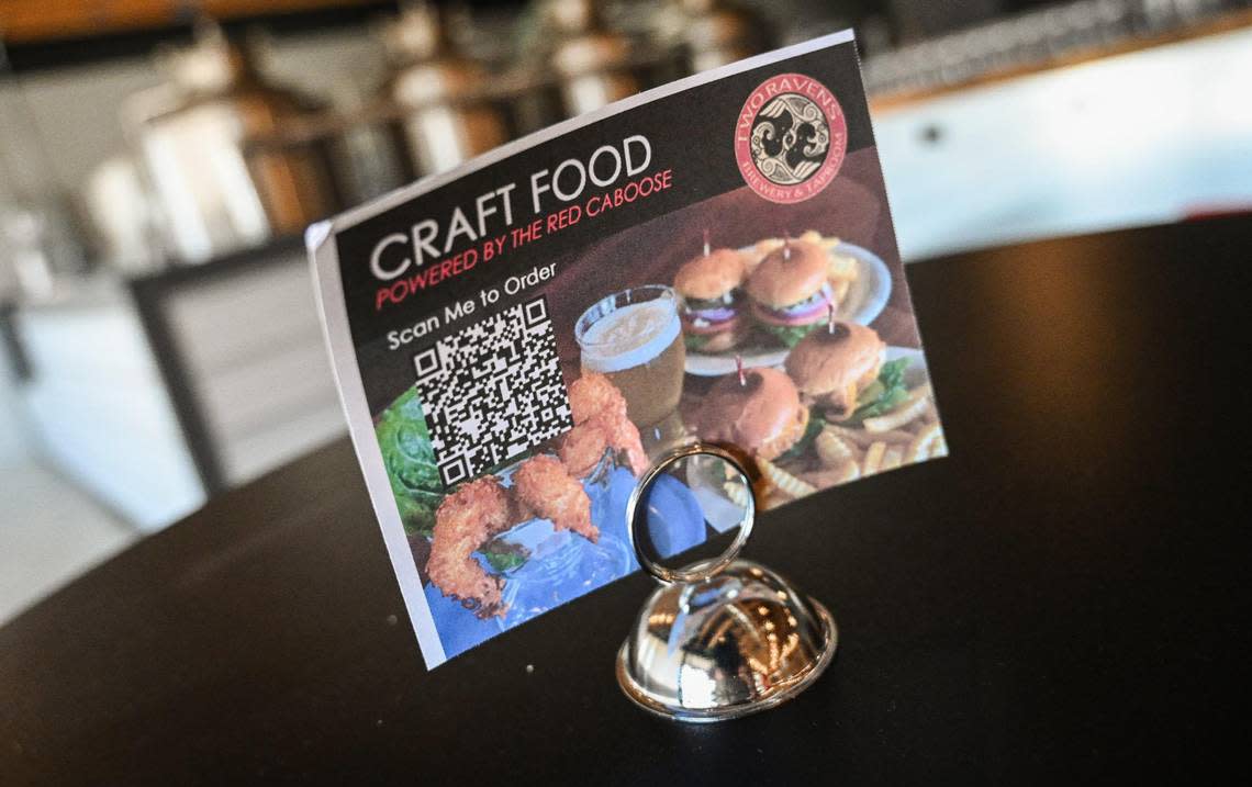 Customers at Two Ravens Brewery & Taproom can order food from the nearby restaurant The Red Caboose from their mobile phones inside the new brewery opening on Shaw and Academy avenues east of Clovis.