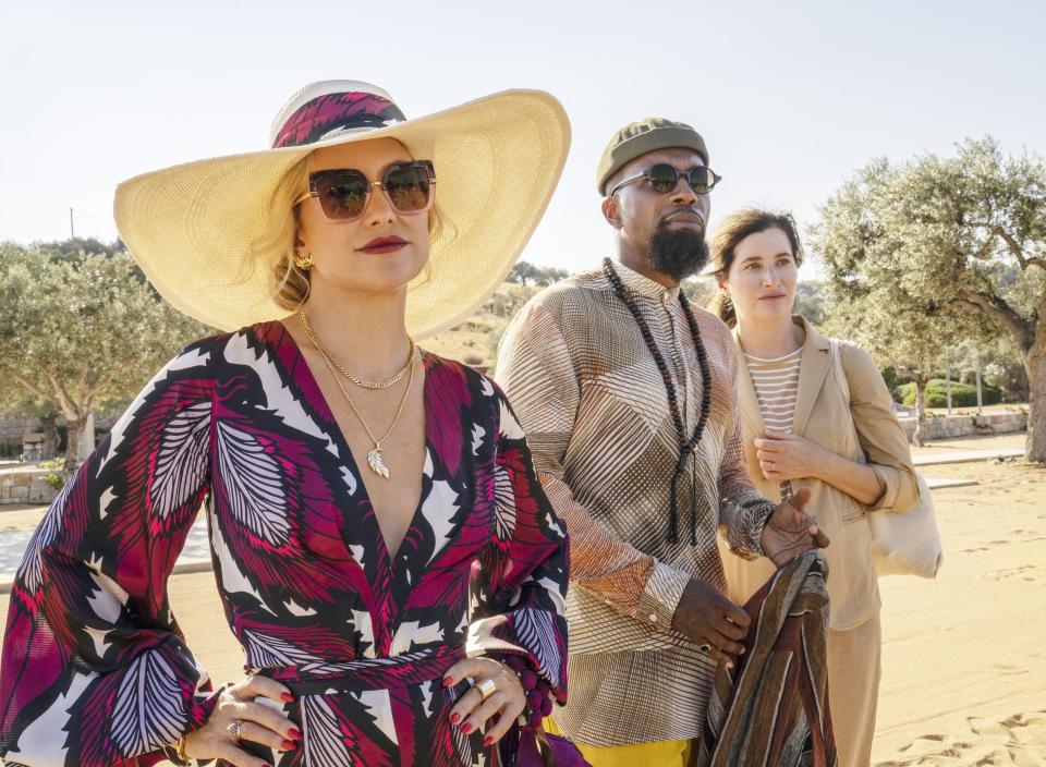 Kate Hudson, Leslie Odom Jr., and Kathryn Hahn stand outside