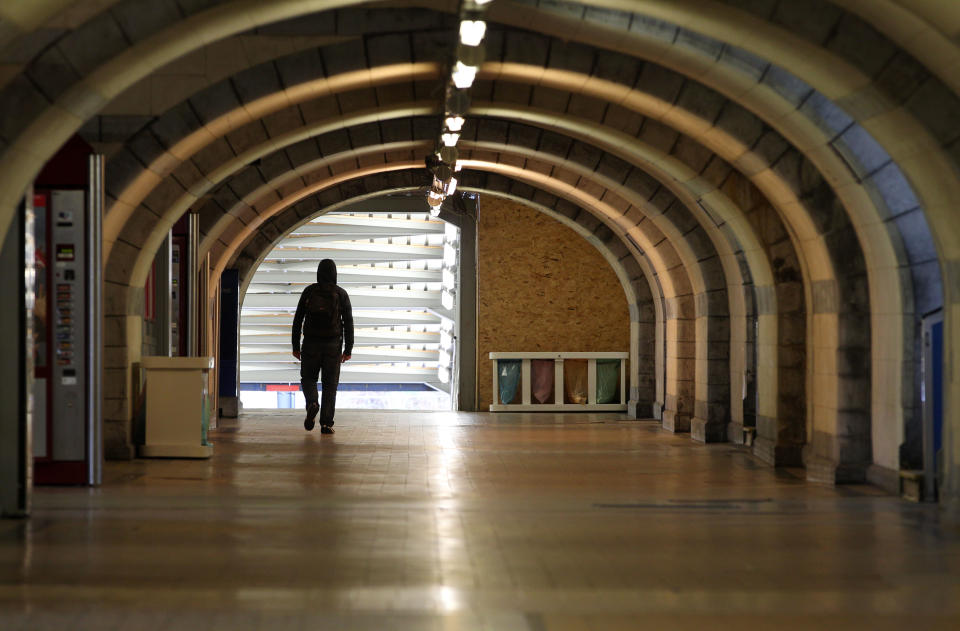 A man walks in a deserted hall at the main train station in Ghent, western Belgium, Wednesday, Oct. 3, 2012. A 24-hour strike by Belgian rail workers on Wednesday paralyzed train traffic throughout Belgium and the international high-speed service to London and Paris. The strike, which started late Tuesday, reached its peak during the Wednesday morning rush hour when tens of thousands of commuters had to take to traffic-choked highways to get into the capital or work. (AP Photo/Yves Logghe)