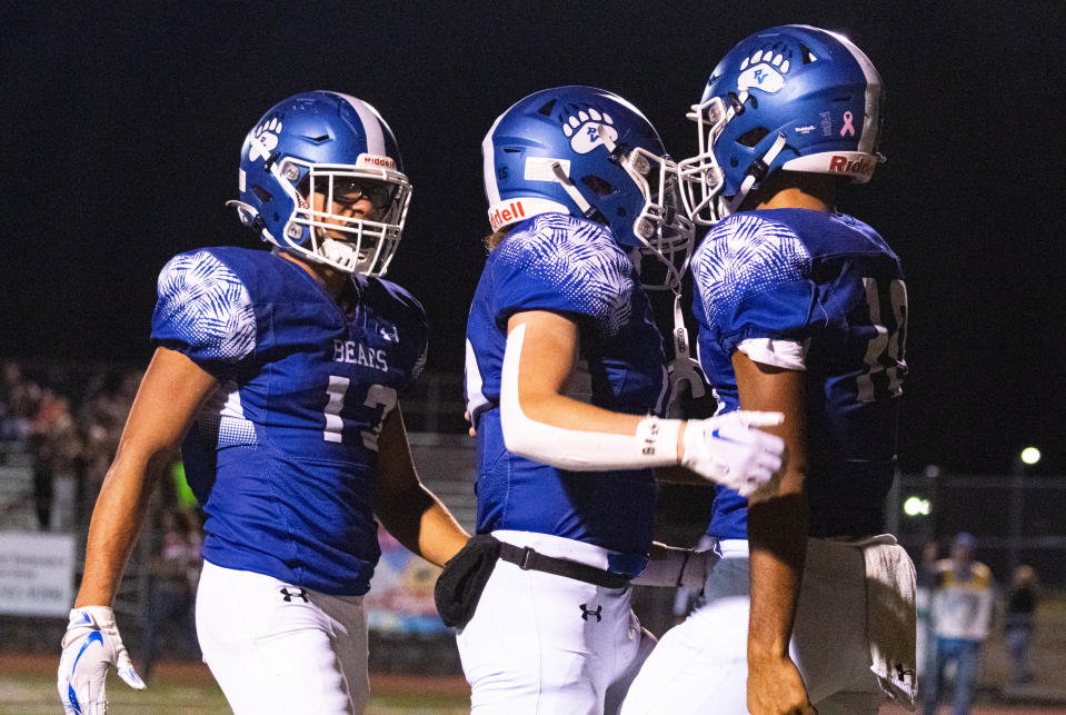 Pleasant Valley's Valentino Byers-Robinson (10) celebrates a touchdown with his teammates, making Pleasant Valley go up 7-0 against Pocono Mountain East at the battle for Old Oaken Bucket on Oct 20, 2023