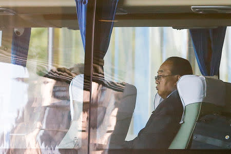 Kim Yong Jae, North Korea's minister of external economic relations, sits in a bus leaving the Belt and Road Forum in Beijing, China, May 14, 2017. Picture taken through a window. REUTERS/Thomas Peter