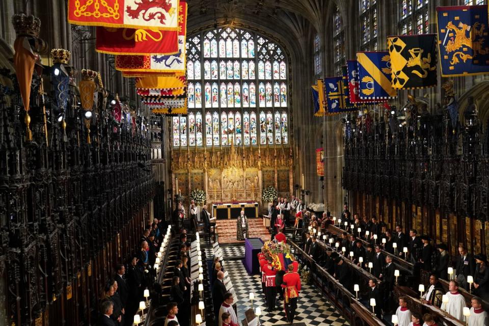 Pallbearers carry the coffin of Britain's Queen Elizabeth II in to St George's Chapel at Windsor Castle.