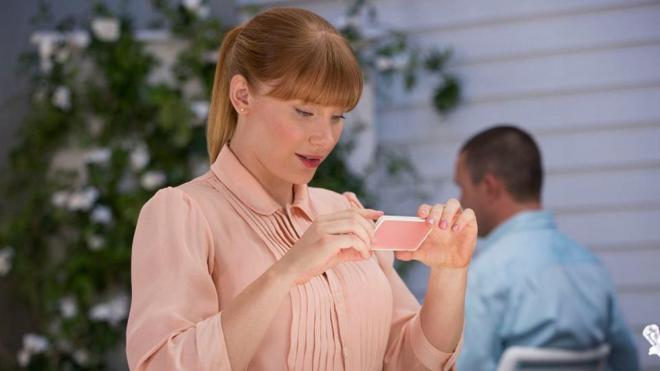 a woman staring at her phone