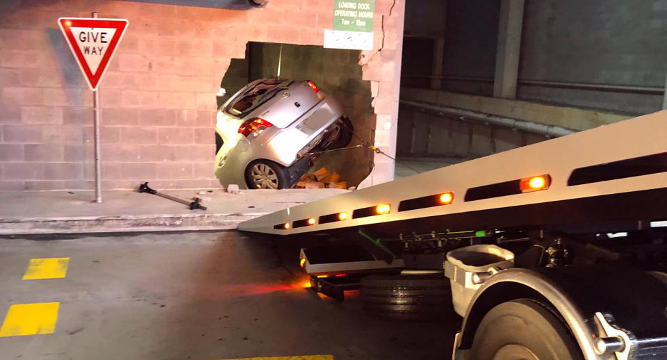 A Toyota Yaris crashed through a wall at Woolworths in Beecroft.