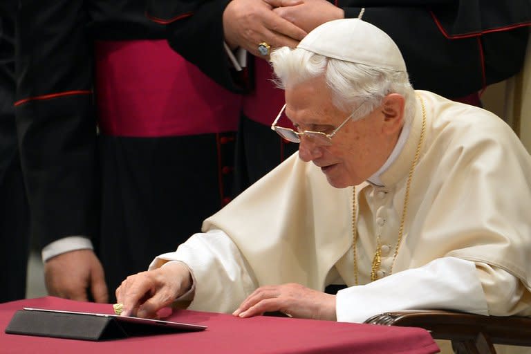 Pope Benedict XVI clicks on a tablet to send his first twitter message during his weekly general audience on December 12, 2012 at the Paul VI hall in the Vatican. "Dear friends, I am pleased to get in touch with you through Twitter. Thank you for your generous response. I bless all of you from my heart," read the tweet