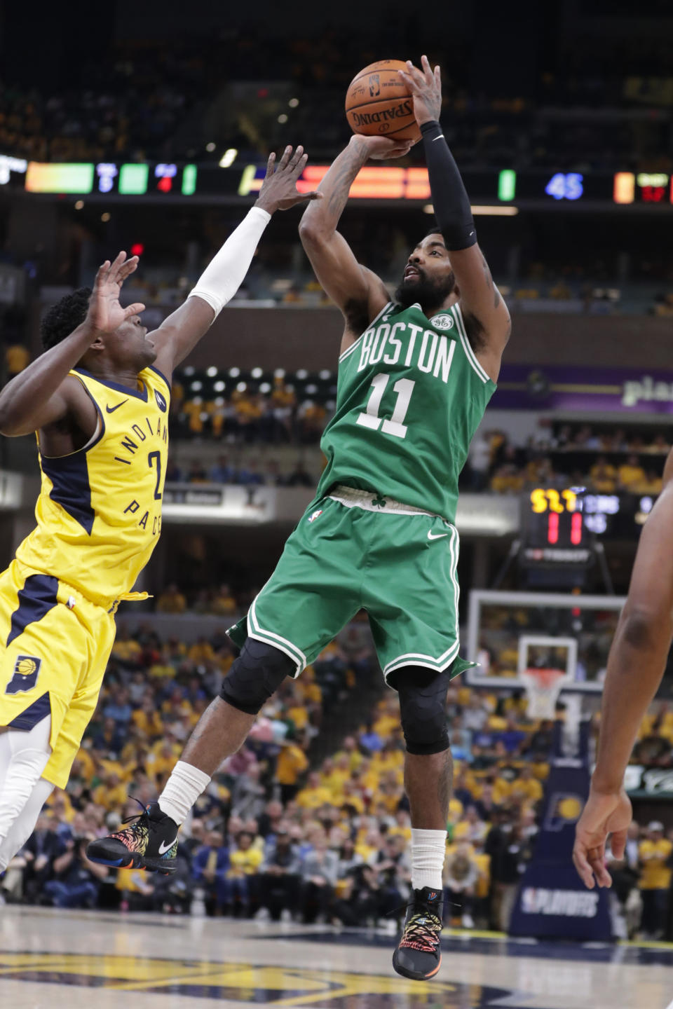 FILE - In this April 21, 2019, file photo, Boston Celtics guard Kyrie Irving (11) shoots over Indiana Pacers guard Darren Collison (2) during the first half of Game 4 of an NBA basketball first-round playoff series in Indianapolis. Just three seasons ago, the Brooklyn Nets were the worst team in the NBA. On Sunday, June 30, 2019, they were the story of the league. They agreed to deals with superstars Kevin Durant and Kyrie Irving as part of a sensational start to free agency, giving the longtime No. 2 team in New York top billing in the Big Apple. (AP Photo/Michael Conroy, File)