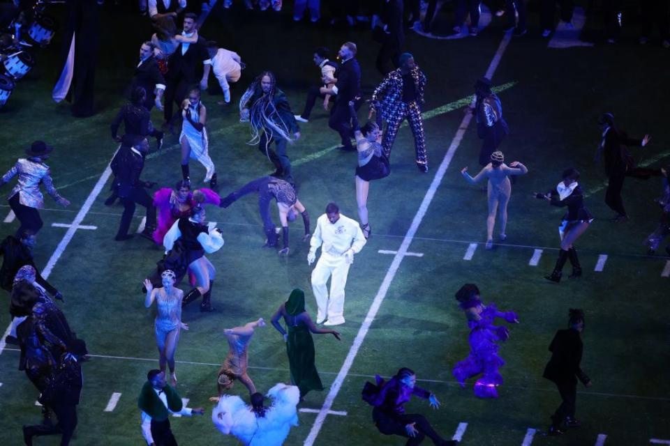 Singer-songwriter Usher performs onstage during the Super Bowl LVIII halftime show.