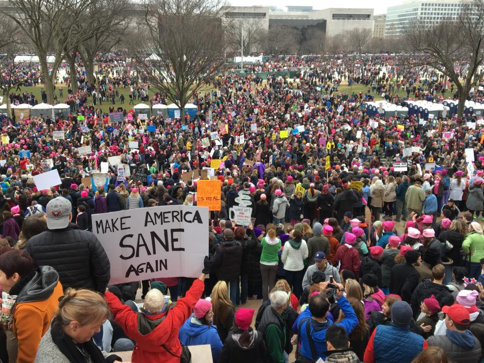 <p>Women with bright pink hats and signs gather early to make their voices heard on the first full day of Donald Trump’s presidency, Jan. 21, 2017, in Washington, D.C. (Photo: Mary F. Calvert for Yahoo News) </p>