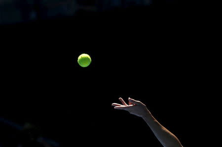 A player prepares to serve at the Australian Open tennis tournament at Melbourne Park, Australia, January 18, 2016. REUTERS/Tyrone Siu