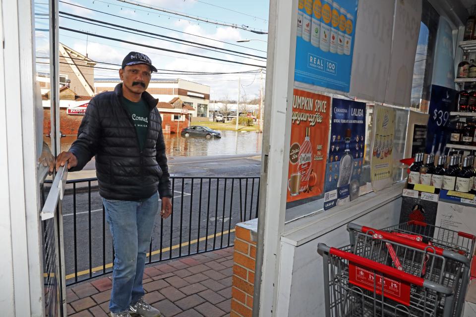Shinu Joseph, the owner of Discount Liquors, is closed due to flooding outside his store on Route 9A in Elmsford Jan. 10, 2024. Joseph said the road often floods after storms and he loses business.
