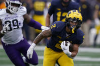 Michigan running back Blake Corum (2) rushes during the first half of an NCAA college football game against Northwestern, Saturday, Oct. 23, 2021, in Ann Arbor, Mich. (AP Photo/Carlos Osorio)