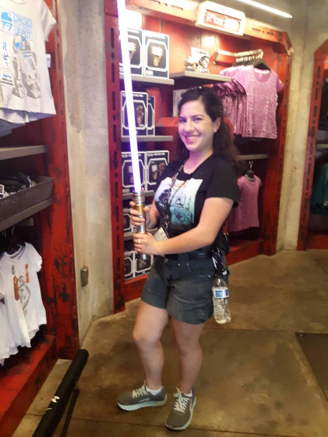 Prosser student Hannah Norris holds a lightsaber while exploring Star Wars Land at Disneyland.