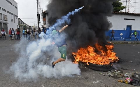 Self-declared acting president Juan Guaido has vowed humanitarian aid would enter Venezuela despite a blockade - Credit: AFP