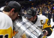 <p>Pittsburgh Penguins center Sidney Crosby (87) and center Evgeni Malkin (71) both kiss the Stanley Cup after defeating the Nashville Predators in Game 6 of the 2017 Stanley Cup Final at Bridgestone Arena. Credit: Christopher Hanewinckel-USA TODAY Sports </p>