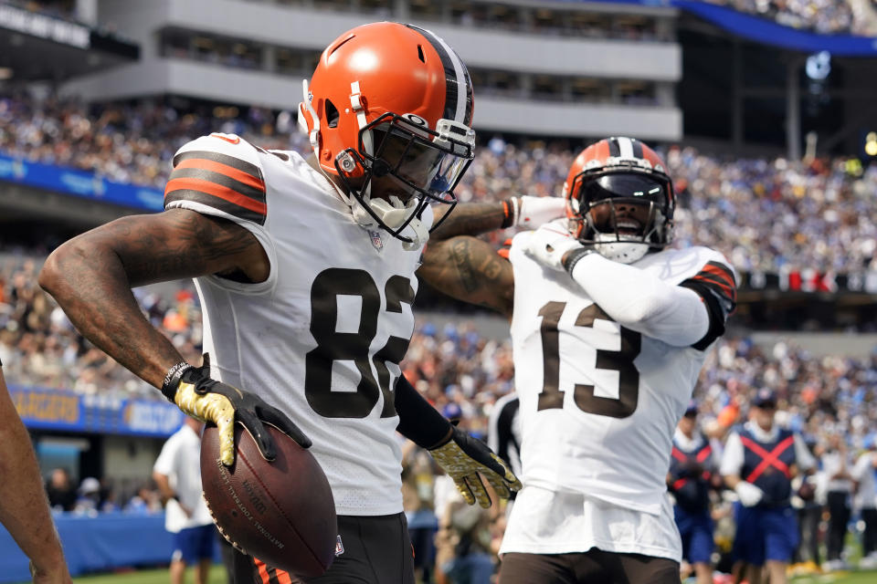 Cleveland Browns wide receiver Rashard Higgins (82) celebrates his touchdown catch with wide receiver Odell Beckham Jr. (13) during the first half of an NFL football game against the Los Angeles Chargers Sunday, Oct. 10, 2021, in Inglewood, Calif. (AP Photo/Gregory Bull)