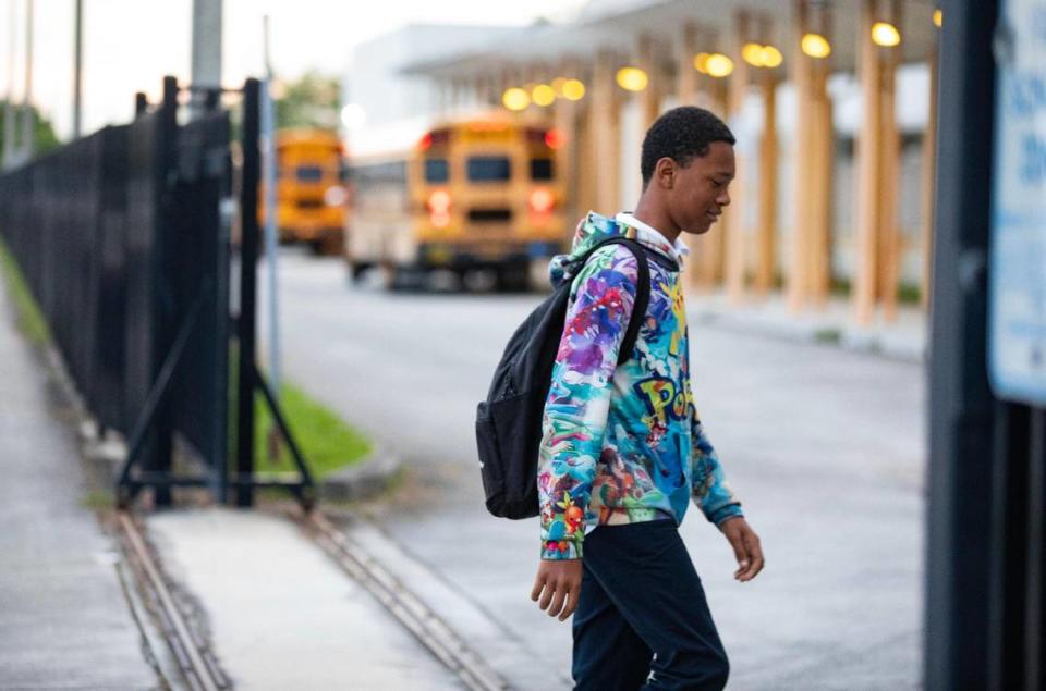 A student walks into Carol City Senior High for the first day of classes on Thursday, Aug. 15, 2023, in Miami Gardens, Fla.