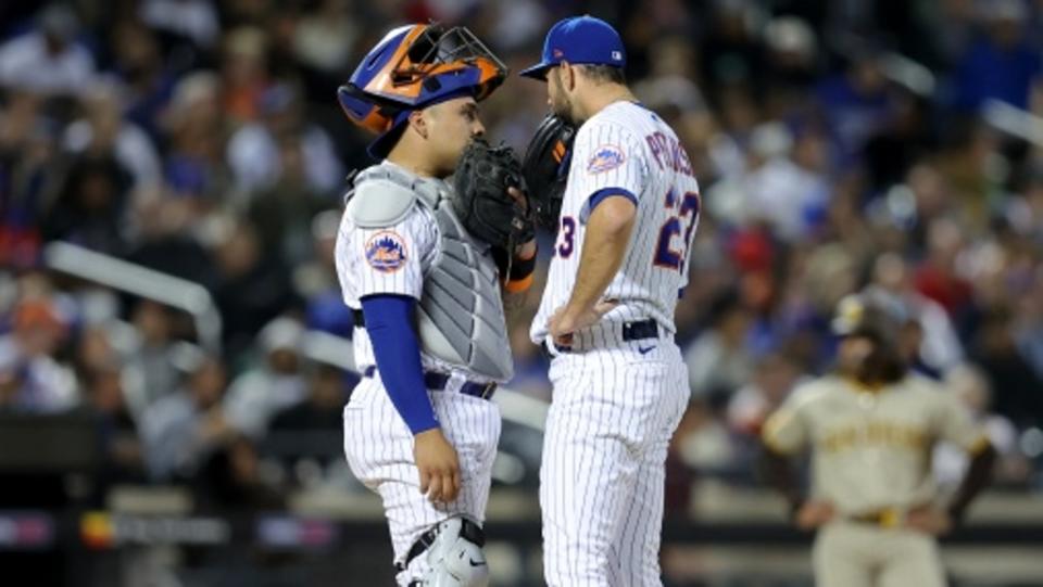 New York Mets catcher Francisco Alvarez (4) talks to starting pitcher David Peterson (23) during the fifth inning against the San Diego Padres at Citi Field