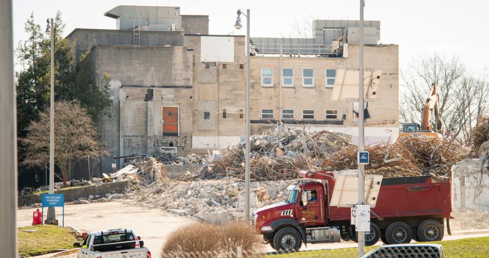 A dump truck hauls away a load of debris from the old IU Health Bloomington Hospital on Second Street on Tuesday, March 7, 2023.