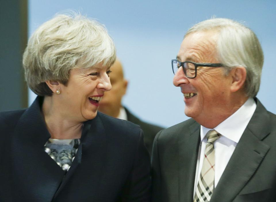 Happy: Theresa May and European Commission president Jean-Claude Juncker (Rex)