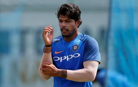 Cricket - Sri Lanka v India - India's Team Practice Session - Galle, Sri Lanka - July 24, 2017 - India's cricketer Umesh Yadav shines the ball on ahead of their first test match. REUTERS/Dinuka Liyanawatte/Files