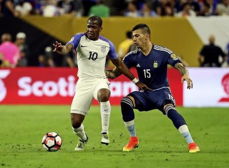 Jun 21, 2016; Houston, TX, USA; United States midfielder Darlington Nagbe (10) and Argentina defender Victor Cuesta (15) battle for the ball during the match in the semifinals of the 2016 Copa America Centenario soccer tournament at NRG Stadium. Kevin Jairaj-USA TODAY Sports