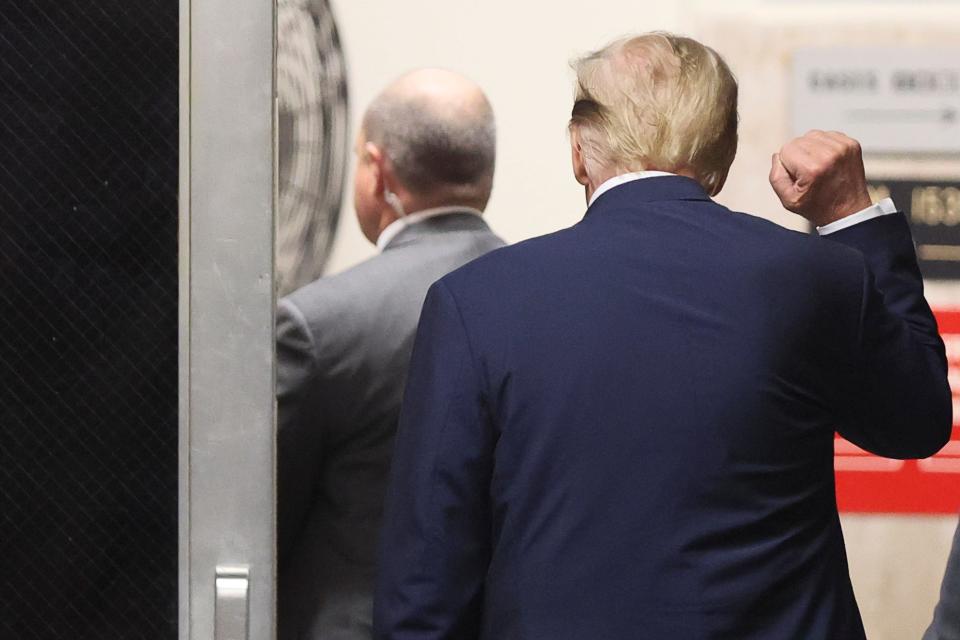 Former President Donald Trump gestures, while he walks during a recess, as his trial continues over charges that he falsified business records to conceal money paid to silence porn star Stormy Daniels in 2016, in Manhattan state court in New York City, U.S. April 18, 2024.