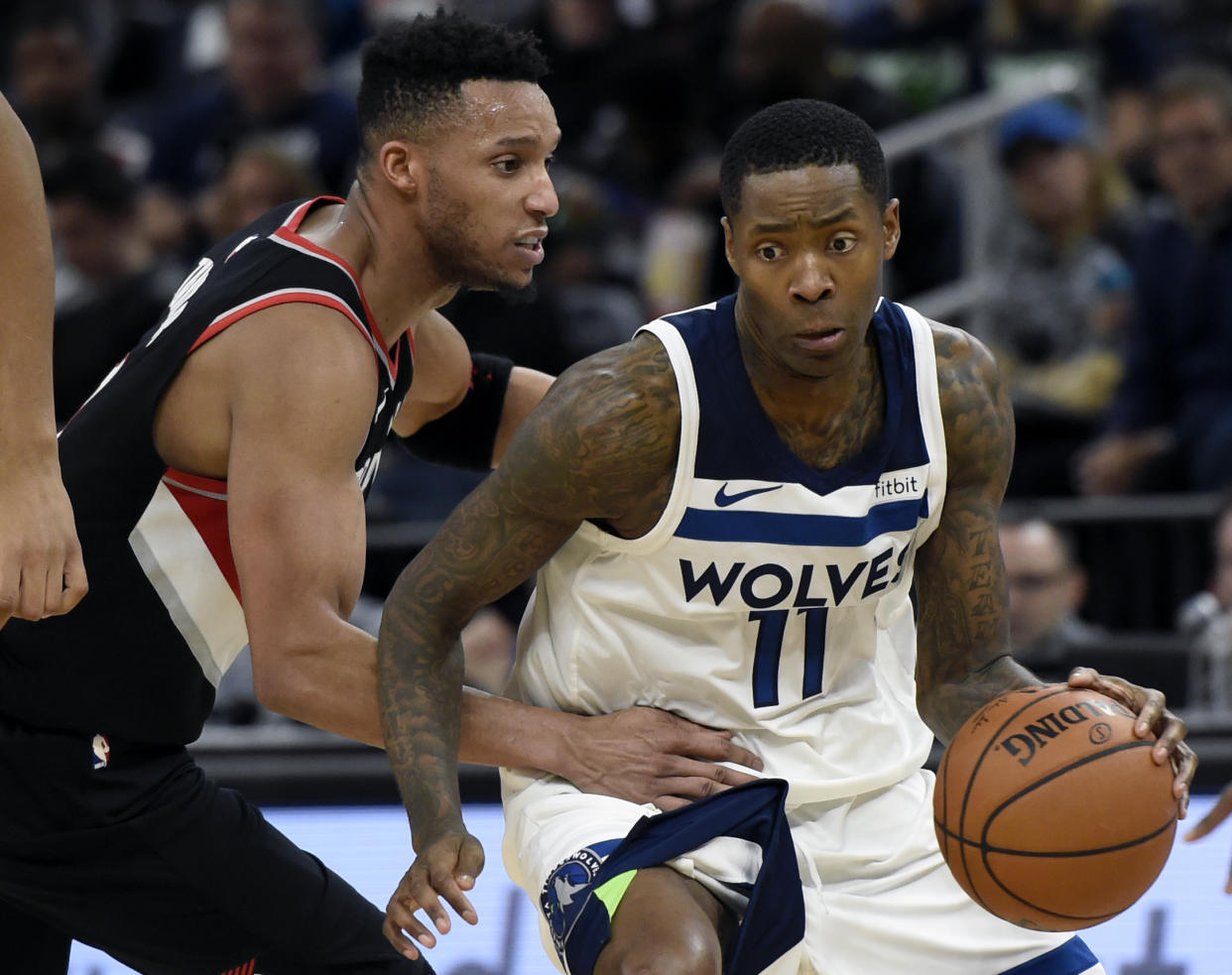 Minnesota Timberwolves guard Jamal Crawford (11) drives against Portland Trail Blazers guard Evan Turner during the fourth quarter of an NBA basketball game on Monday, Dec. 18, 2017, in Minneapolis. (AP Photo/Hannah Foslien)