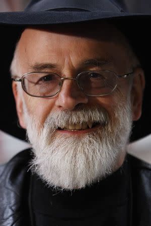 British author Terry Pratchett poses for a photograph after delivering a petition on behalf of the Alzheimer's Research Trust to 10 Downing Street in London, in this November 26, 2008 file photograph. REUTERS/Suzanne Plunkett/files