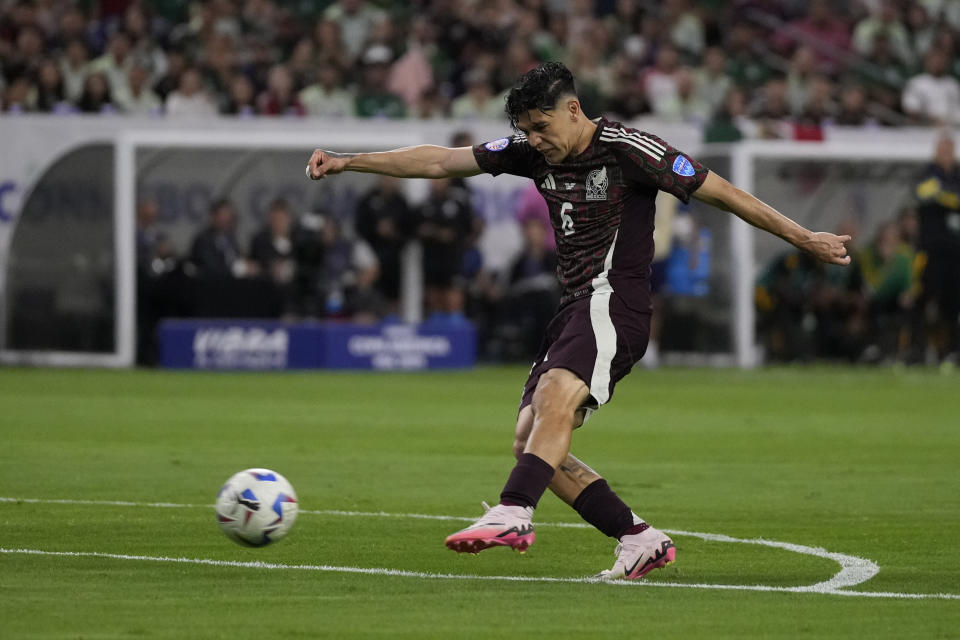 Mexico's Gerardo Arteaga scores his side's opening goal against Jamaica during a Copa America Group B soccer match in Houston, Saturday, June 22, 2024. (AP Photo/David J. Phillip)