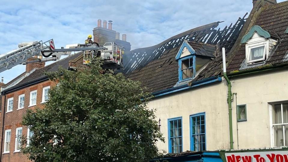 Aerial ladder and firefighters in Great Yarmouth