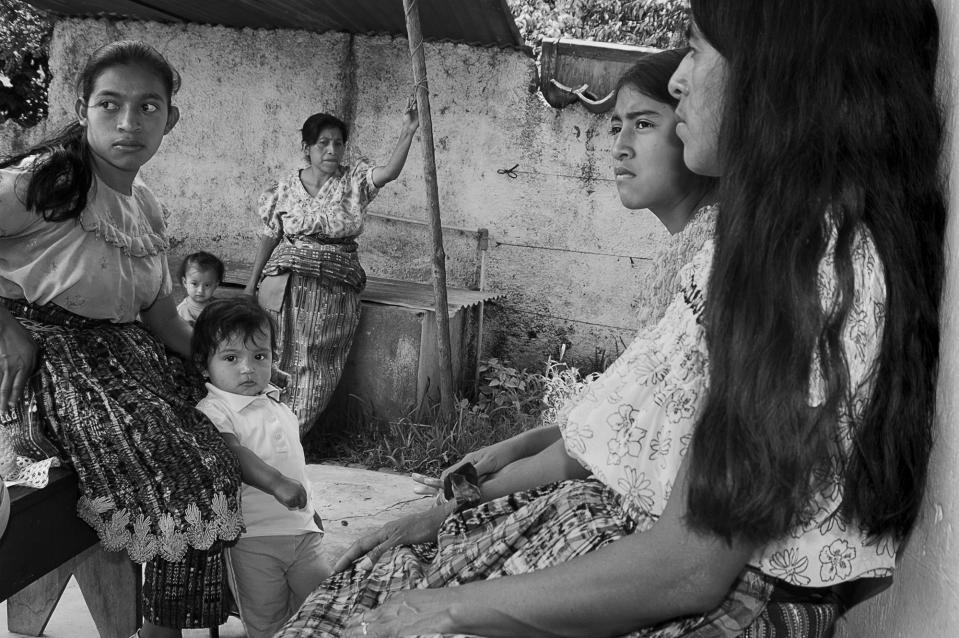 <p>Villagers waiting to be seen by a healer in San Pedro la Laguna, Guatemala. (Photograph by Fran Antmann) </p>