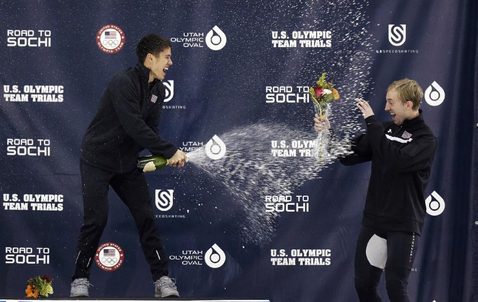 First-place finisher J.R. Celski, left, celebrates with third place finisher Chris Creveling, right, after winning the men's 1,500 meters during the U.S. Olympic short track speedskating trials, Friday, Jan. 3, 2014, in Kearns, Utah. (AP Photo/Rick Bowmer)