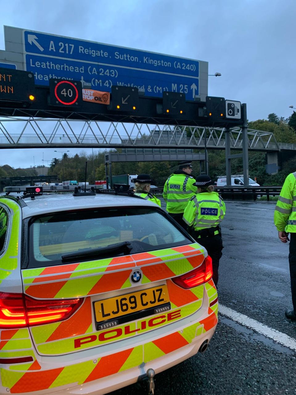 Surrey Police officers along the M25 after making an arrest on Wednesday morning (Surrey Police)