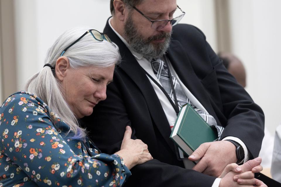 Kim and Ken Kennington hold each other during prayer at the Utah State Correctional Facility during the sacrament service at The Church of Jesus Christ of Latter-day Saints’ prison ministry in Salt Lake City on Sunday, Jan. 28, 2024. | Marielle Scott, Deseret News