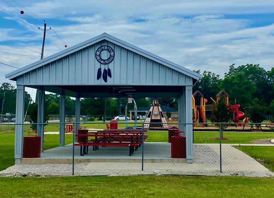 A picnic area, playground, and walking trail, seen here on June 15, 2023, are beside the MOWA Band of Choctaw Indians Richard Shelby Center Tribal Office & Housing Authority in Mount Vernon, Alabama.