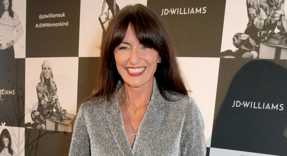 Davina McCall made a statement about sustainable fashion by rewearing a dress from a past series of The Masked Singer. (Getty Images)