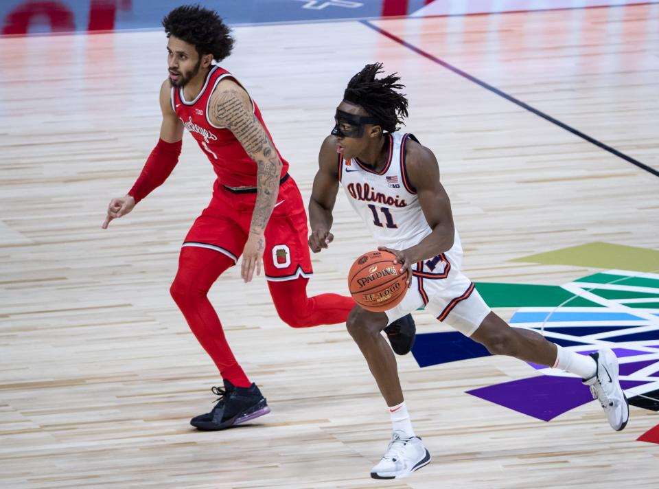 Illinois Fighting Illini guard Ayo Dosunmu (11) drives the ball quickly down the court during the Big Ten Tournament title game Sunday, March 14, 2021, at Lucas Oil Stadium in Indianapolis. (Via OlyDrop)