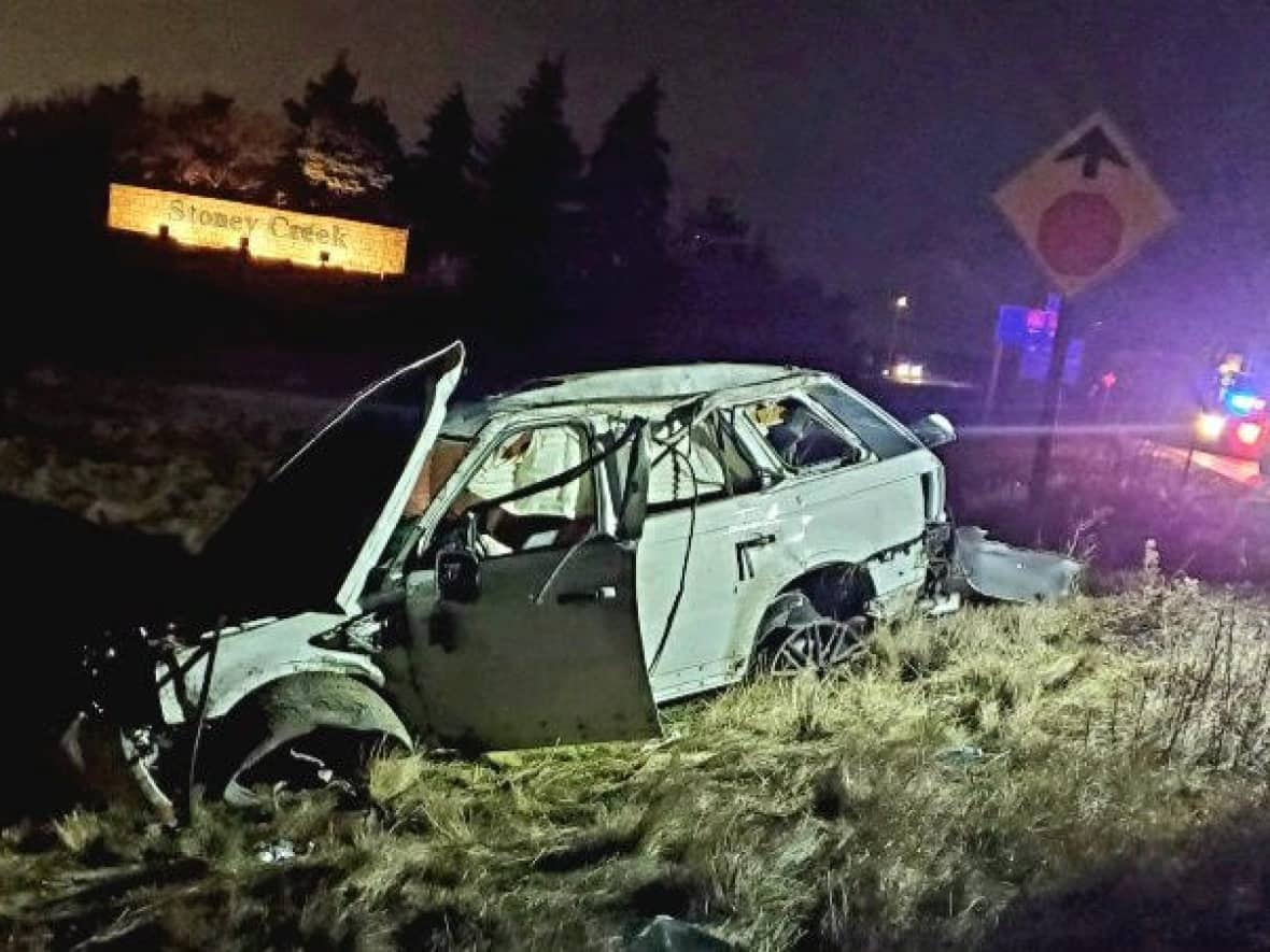 Ontario Provincial Police say the driver of this car lost control, left the road and rolled. The driver, a Brampton man, 24, died at the scene, while a passenger was injured. (Ontario Provincial Police - image credit)