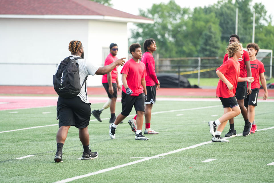 Zyair Anderson is part of UC's BIPOC Teacher Pathway program. UC will pay for his schooling so that he can become a teacher. Anderson currently coaches Colerain's football team. Phil Didion/The Enquirer