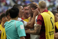 Serbia's Strahinja Pavlovic, center, celebrates with bis teammates after scoring his side's opening goal during the World Cup group G soccer match between Cameroon and Serbia, at the Al Janoub Stadium in Al Wakrah, Qatar, Monday, Nov. 28, 2022. (AP Photo/Francisco Seco)