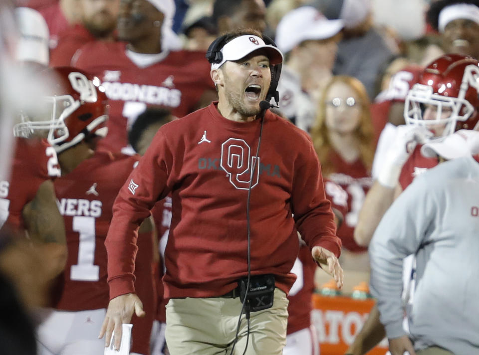 FILE - Then Oklahoma head coach Lincoln Riley yells to his team before a play during the first half of an NCAA college football game against TCU, Saturday, Oct. 16, 2021, in Norman, Okla.Riley, one of college football's most successful young coaches who won 85 percent of his games in five seasons at Oklahoma and led the Sooners to four Big 12 titles and four New Year's Six bowls with three College Football Playoff appearances, has been named the head coach at USC, athletic director Mike Bohn announced Sunday, Nov. 28, 2021. (AP Photo/Alonzo Adams, File)