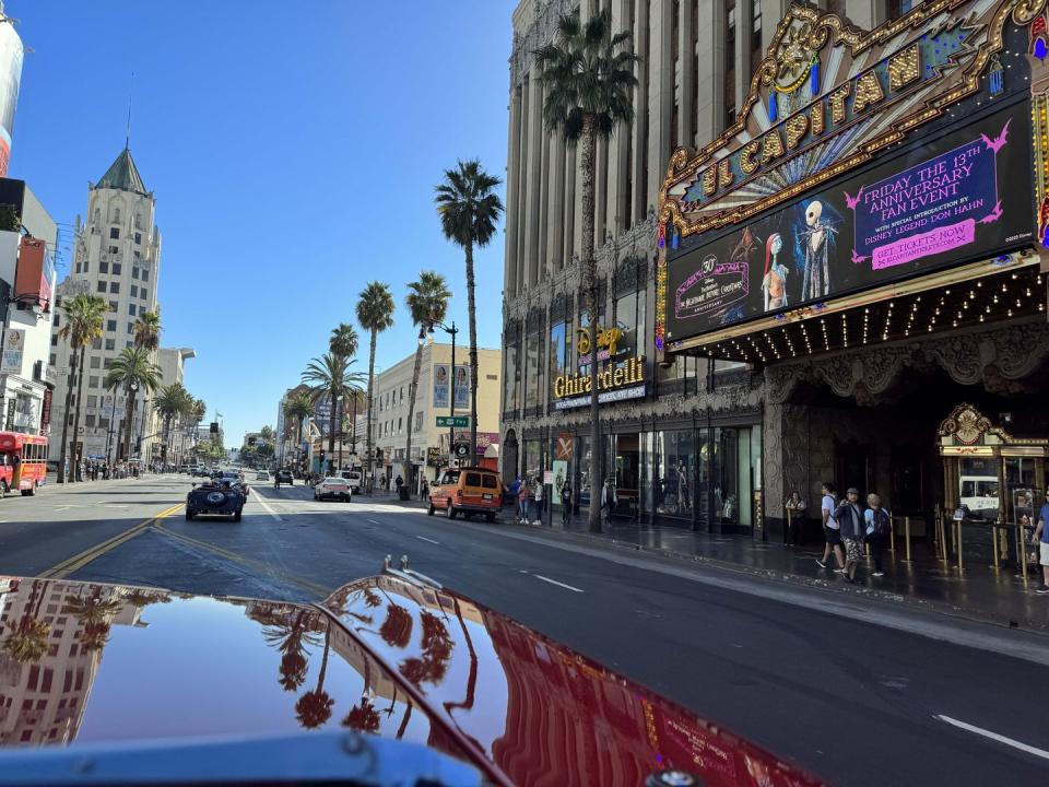 a street with cars and buildings on either side of it