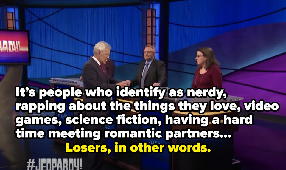Woman saying "It's people who identify as nerdy, rapping about the things they love, video games, sci-fi, having a hard time meeting romantic partners" and Alex says, "Losers, in other words"