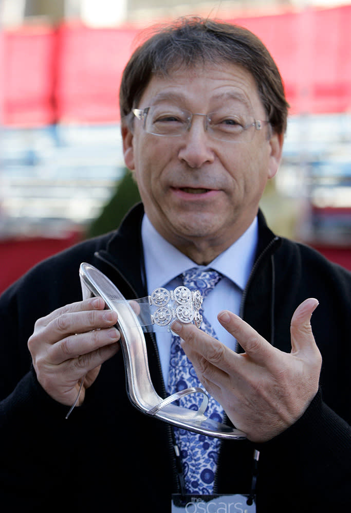 Stuart Weitzman holds the Diamond Dream Stiletto shoe. - Credit: Shutterstock