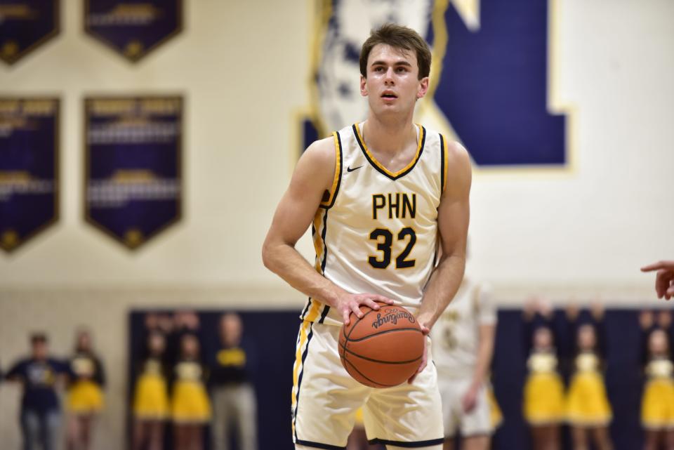 Port Huron Northern's Tyler Jamison sets for a free throw during the Huskies' 80-77 loss to Macomb Dakota in a Division 1 district final at Port Huron Northern High School on Friday, March 10, 2023.