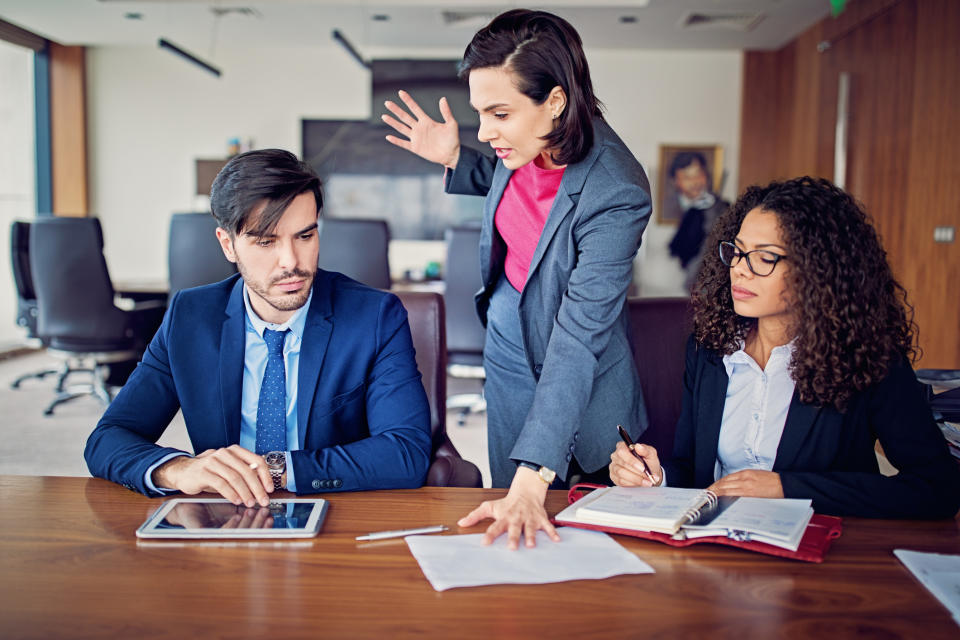 Manager is shouting to employee after his mistake in the CEO office. Source: Getty