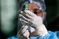 FILE PHOTO: A health official draws a dose of the AstraZeneca's COVID-19 vaccine manufactured by the Serum Institute of India, at Infectious Diseases Hospital in Colombo